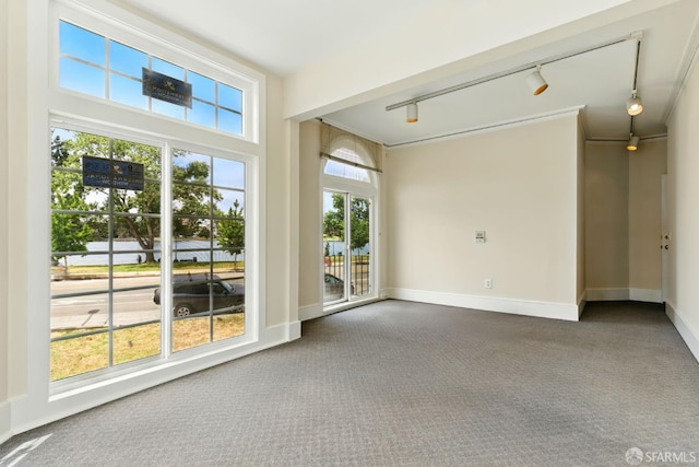 2108 Lakeshore Ave, Oakland, CA 94606 - unfurnished room with track lighting, dark carpet, and plenty of natural light