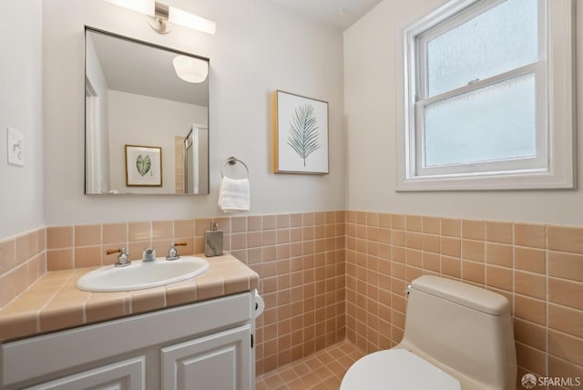 1867 15th Ave, San Francisco, CA 94122 - bathroom featuring vanity, tile walls, and wainscoting