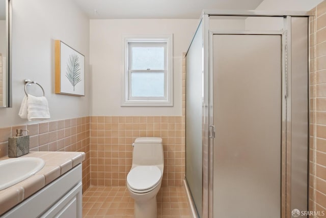 1867 15th Ave, San Francisco, CA 94122 - full bath featuring tile walls, vanity, a stall shower, wainscoting, and tile patterned flooring