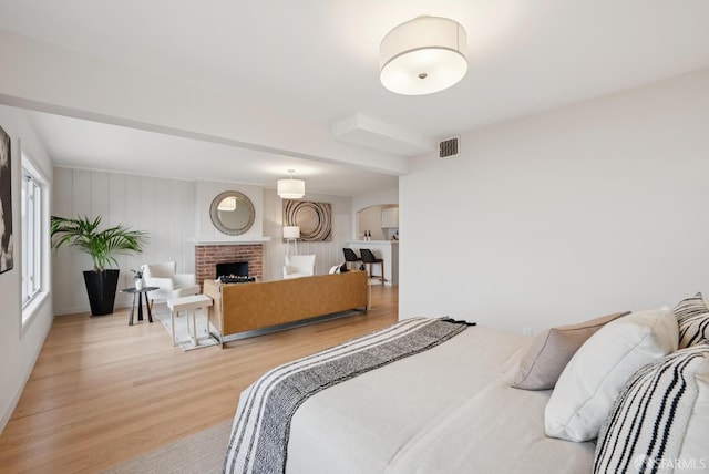 1867 15th Ave, San Francisco, CA 94122 - bedroom with light wood finished floors and a fireplace