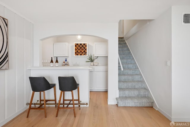 1867 15th Ave, San Francisco, CA 94122 - indoor bar with light wood-style flooring and stairway