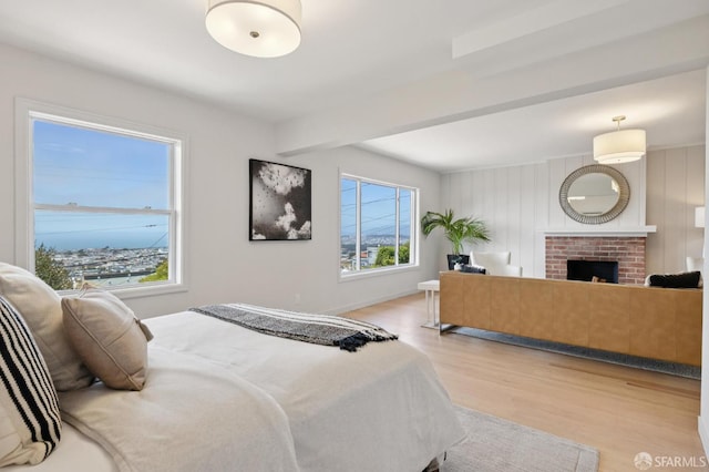 1867 15th Ave, San Francisco, CA 94122 - bedroom featuring light wood-style flooring and a fireplace