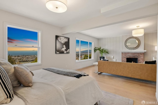 1867 15th Ave, San Francisco, CA 94122 - bedroom featuring wood finished floors, a fireplace, and beam ceiling