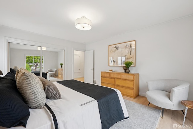 1867 15th Ave, San Francisco, CA 94122 - bedroom with light wood-style flooring and a closet
