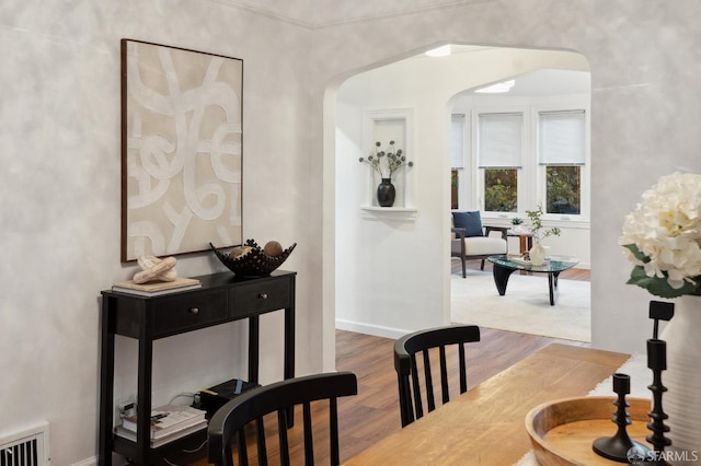 65 Danton St, San Francisco, CA 94112 - dining area featuring arched walkways and wood finished floors