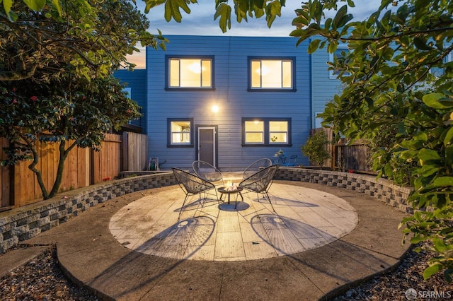 65 Danton St, San Francisco, CA 94112 - rear view of house with a patio area, a fenced backyard, and outdoor dining space