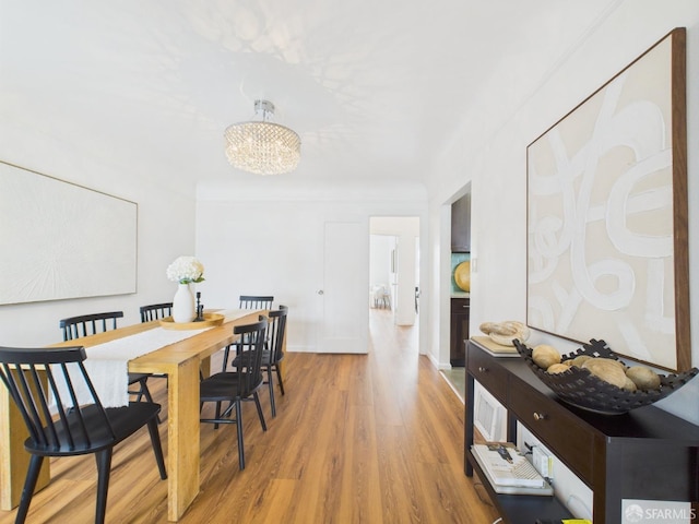 65 Danton St, San Francisco, CA 94112 - dining area with light wood finished floors and a chandelier