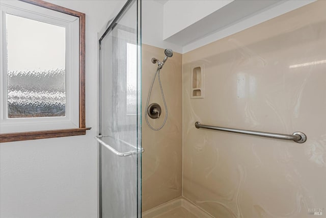 full bathroom featuring a shower stall