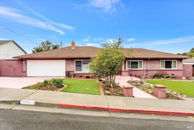 ranch-style home featuring driveway, a chimney, roof with shingles, an attached garage, and a front lawn