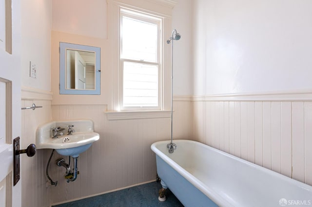 bathroom with a tub to relax in