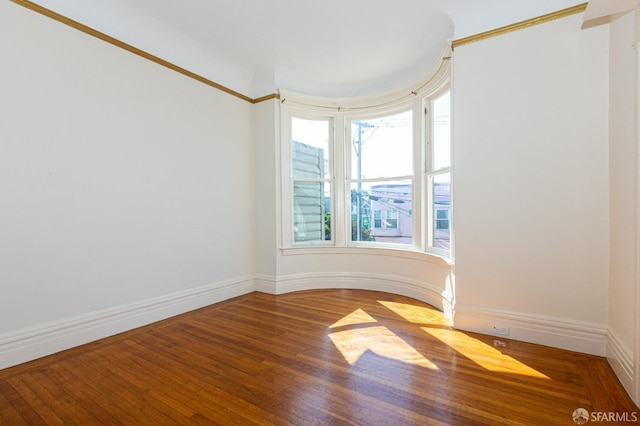 unfurnished room featuring wood-type flooring