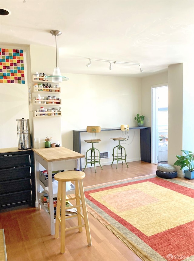 81 Frank Norris St Unit 501, San Francisco, CA 94109 - bar area featuring wood finished floors and track lighting