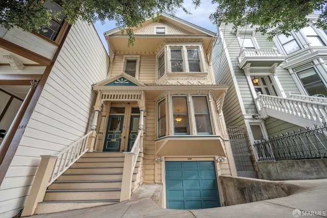 townhome / multi-family property featuring french doors and an attached garage