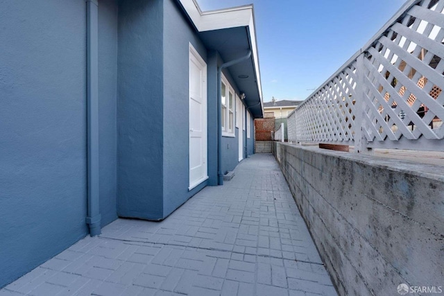 view of side of home featuring stucco siding