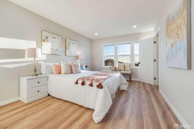 bedroom featuring recessed lighting, light wood-style flooring, and baseboards