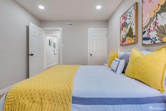 bedroom with visible vents and recessed lighting