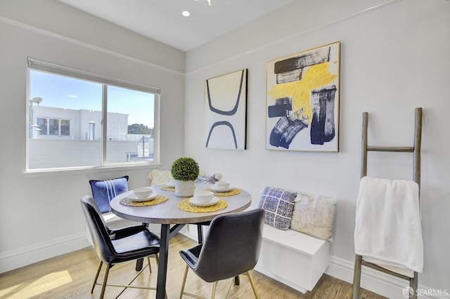 dining area featuring hardwood / wood-style floors