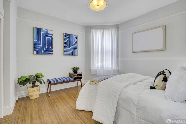 bedroom with wood-type flooring