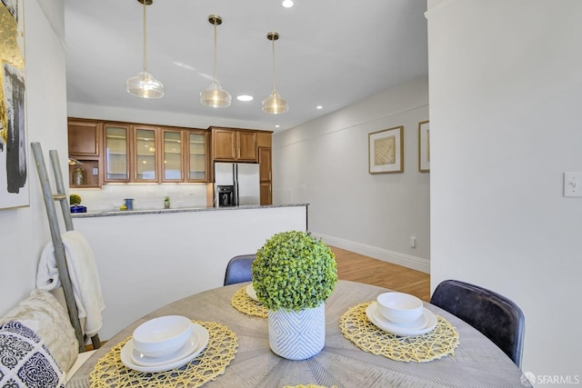 dining space featuring light hardwood / wood-style flooring