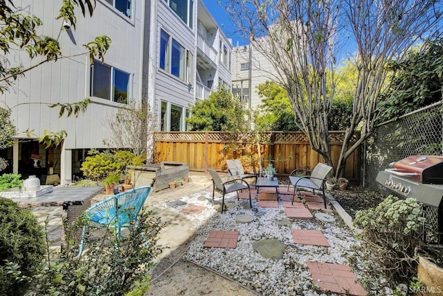 view of patio / terrace featuring an outdoor fire pit