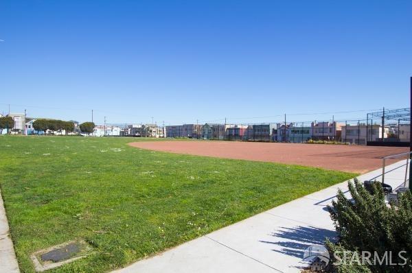 surrounding community with a yard