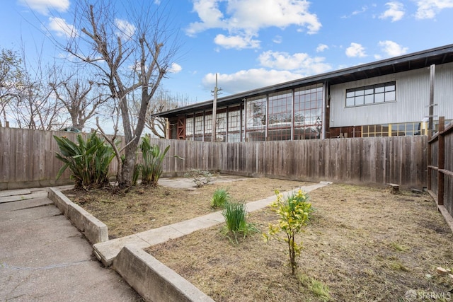 view of yard with a fenced backyard