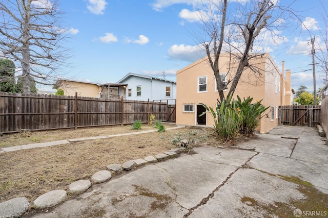 view of yard with a patio and a fenced backyard