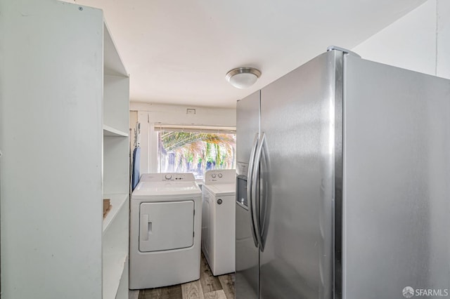 3233 Ellis St, Berkeley, CA 94703 - washroom featuring separate washer and dryer and light wood-type flooring