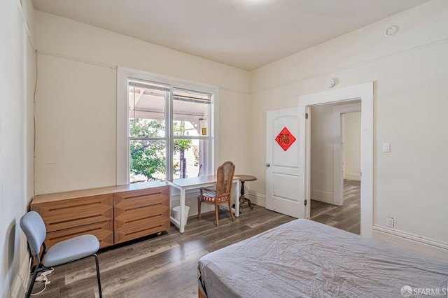 3233 Ellis St, Berkeley, CA 94703 - bedroom featuring wood finished floors and baseboards