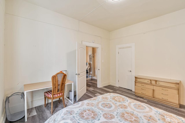 3233 Ellis St, Berkeley, CA 94703 - bedroom with wood finished floors, baseboards, and an office area