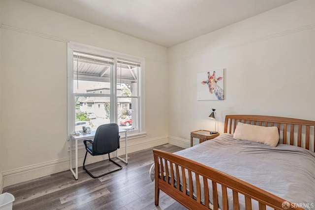 3233 Ellis St, Berkeley, CA 94703 - bedroom with wood finished floors, baseboards, and an office area