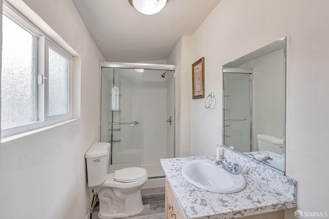 3233 Ellis St, Berkeley, CA 94703 - full bath featuring toilet, vanity, a shower stall, and wood finished floors