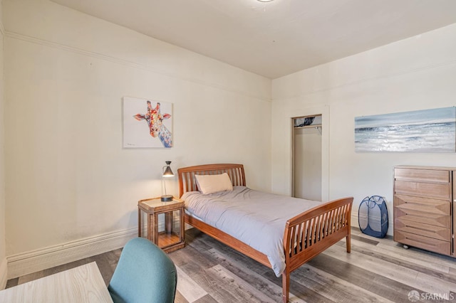 3233 Ellis St, Berkeley, CA 94703 - bedroom featuring wood finished floors and baseboards