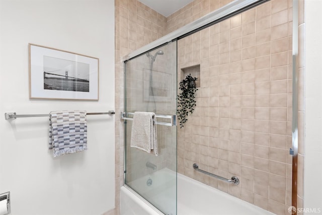 full bath featuring shower / bath combination with glass door