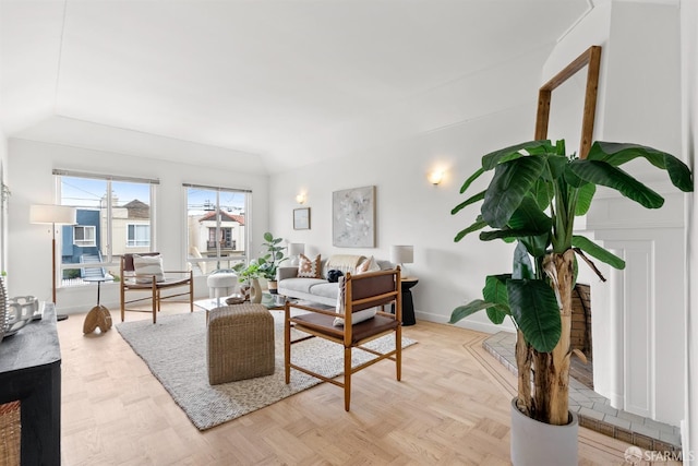 living area featuring baseboards