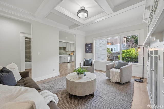 living room with coffered ceiling, wood finished floors, beam ceiling, and baseboards