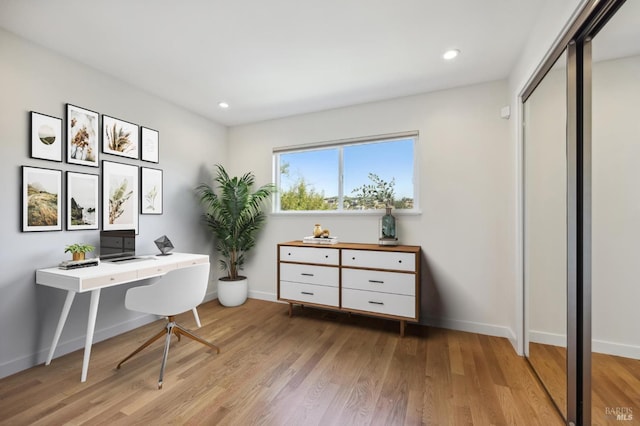 office space with light hardwood / wood-style flooring