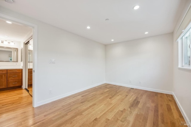 unfurnished room with light hardwood / wood-style flooring