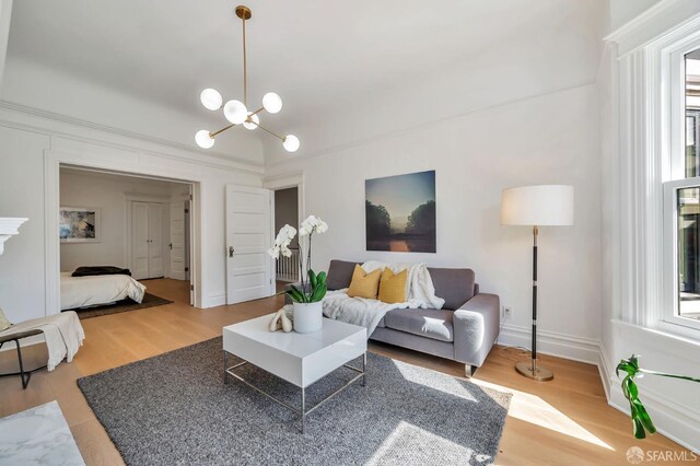 289 Church St, San Francisco, CA 94114 - living area with plenty of natural light, wood finished floors, and a chandelier