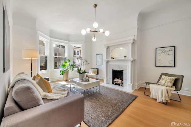 289 Church St, San Francisco, CA 94114 - living area with a high end fireplace, wood finished floors, and a chandelier