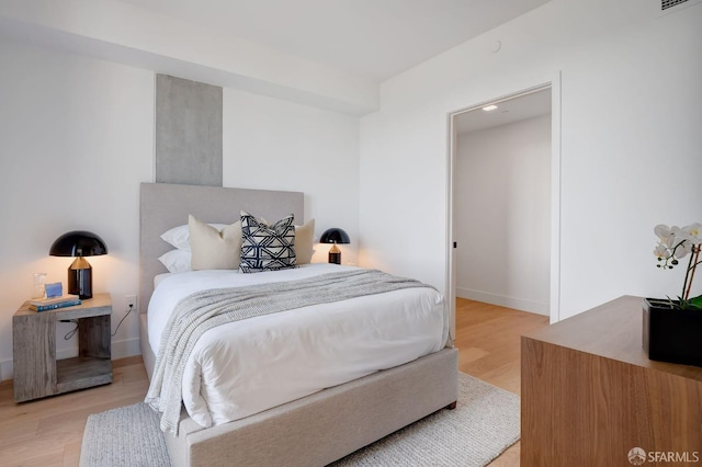 bedroom with light hardwood / wood-style flooring