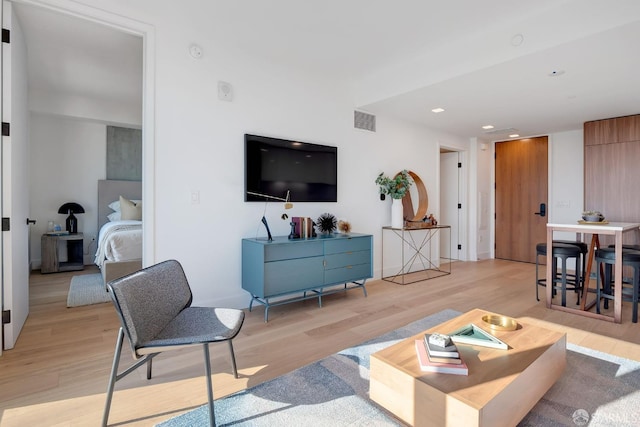 living room with light hardwood / wood-style flooring