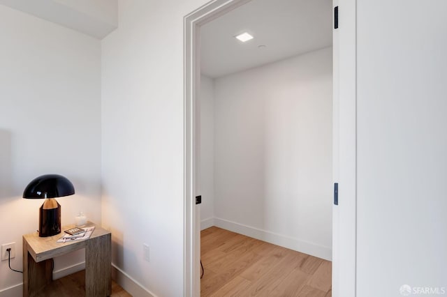 corridor with light wood-type flooring