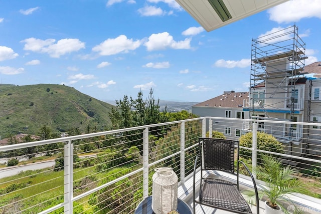 balcony featuring a mountain view