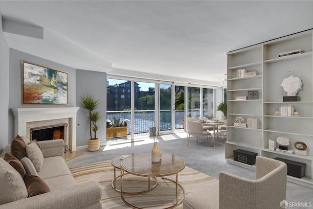 living room with light colored carpet and a fireplace