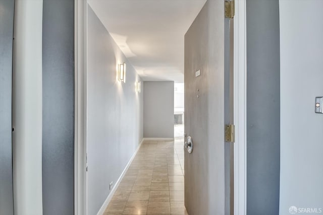 corridor with light tile patterned floors