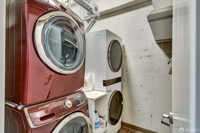 laundry area featuring stacked washer and clothes dryer