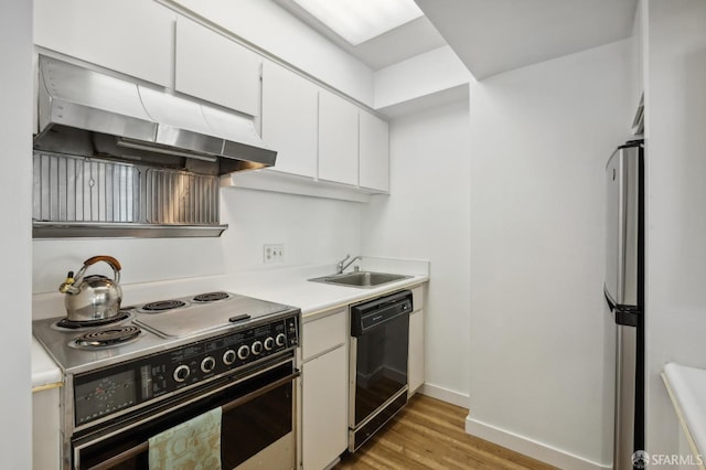 kitchen featuring black appliances, white cabinets, sink, light wood-type flooring, and range hood