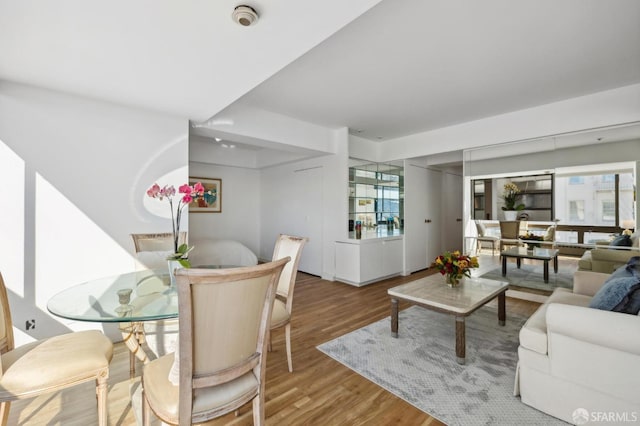 dining room with hardwood / wood-style flooring and plenty of natural light