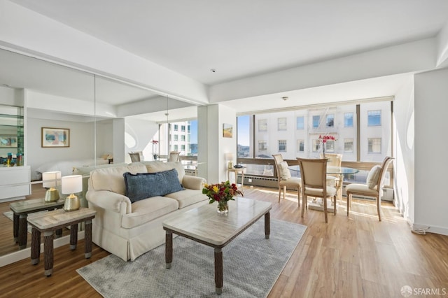 living room with light hardwood / wood-style flooring